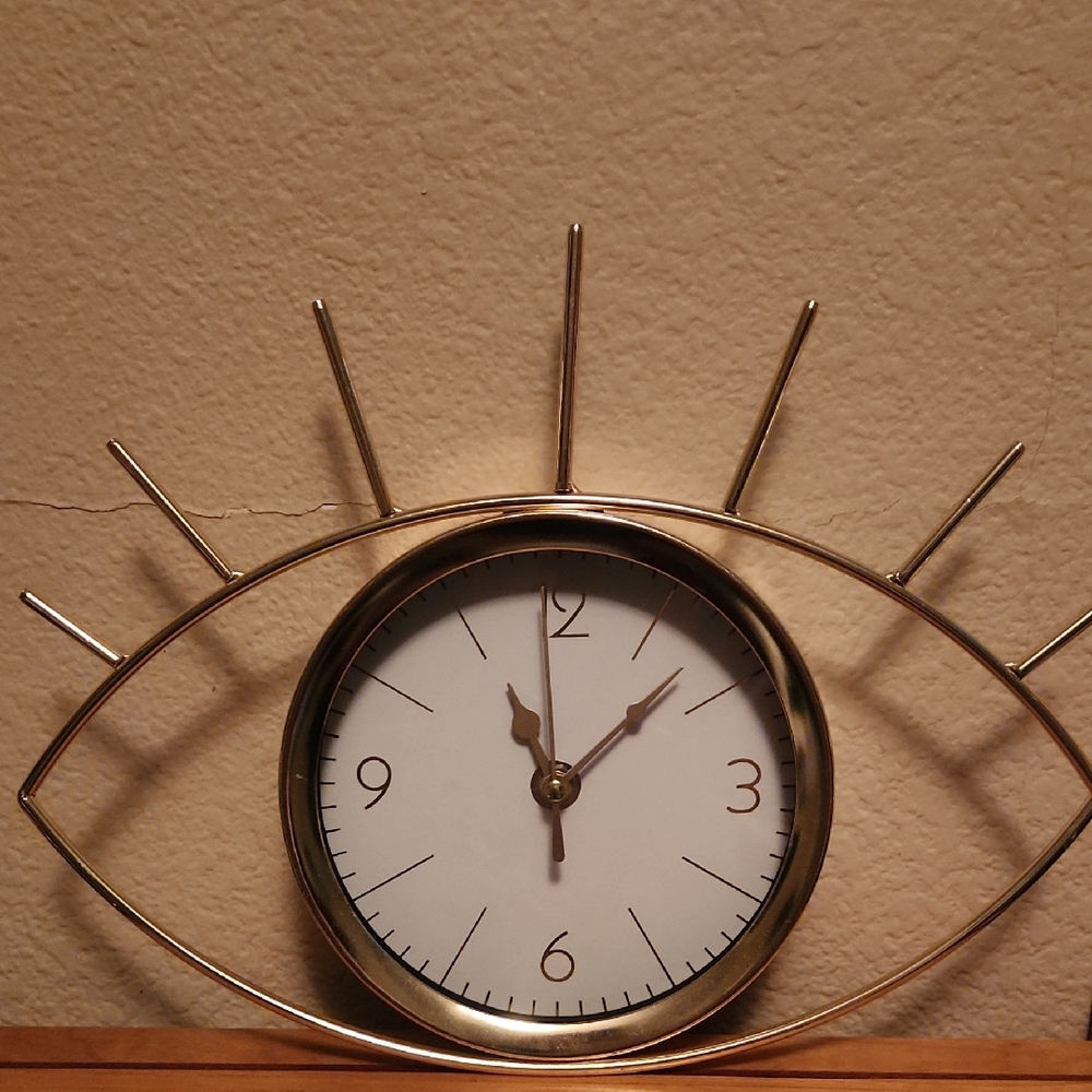 Gold Eye-Shaped Wall Clock